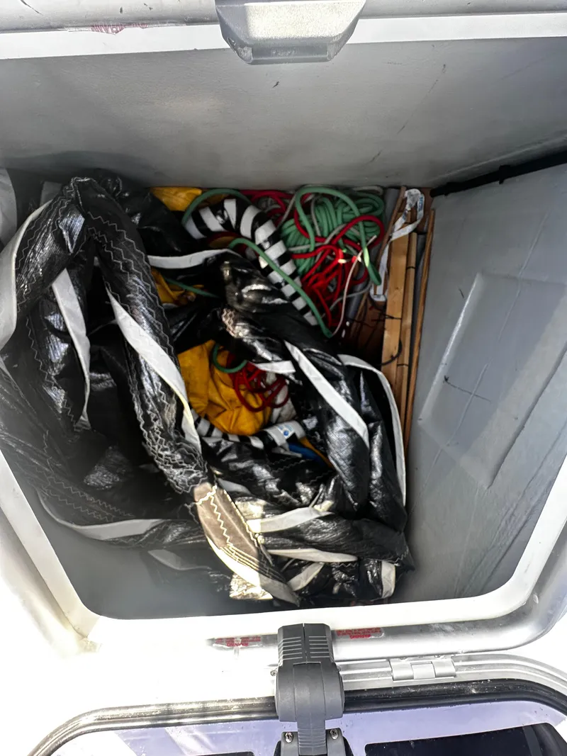 Slide: The Image of Storage compartment on a 2017 Lagoon 450 F yacht with ropes and bags. - 44