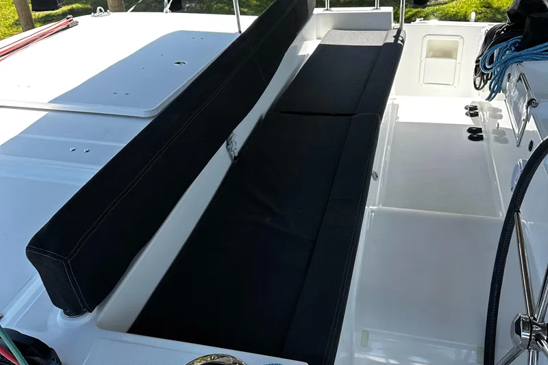 Slide: The Image of 2017 Lagoon 450 F yacht deck with black seating and ropes. - 47