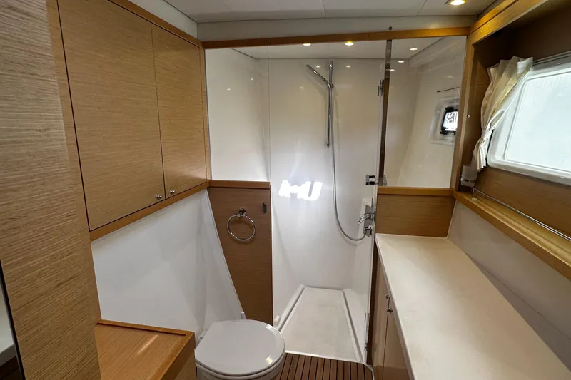 Slide: The Image of Luxurious bathroom in 2017 Lagoon 450 F yacht with modern fixtures and wooden accents. - 55