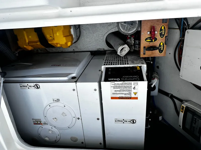 Slide: The Image of Engine compartment of a 2017 Lagoon 450 F catamaran with Cummins Onan generator. - 68