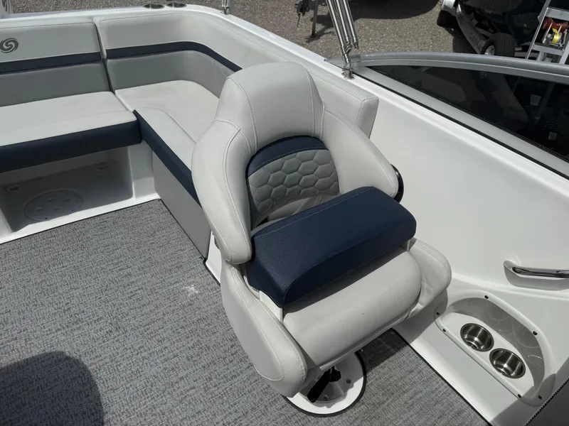 Slide: The Image of 2021 Hurricane SunDeck 217 OB boat interior with cushioned seating and modern design. - 17