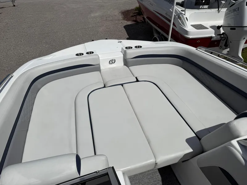 Slide: The Image of 2021 Hurricane SunDeck 217 OB boat with spacious seating and cup holders. - 21