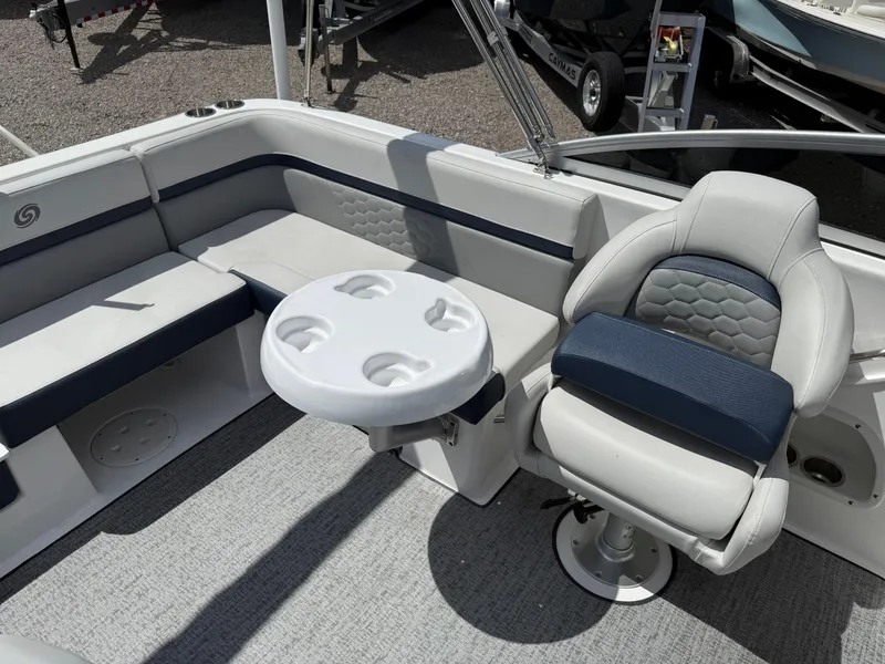 Slide: The Image of 2021 Hurricane SunDeck 217 OB boat interior with seating and table. - 22