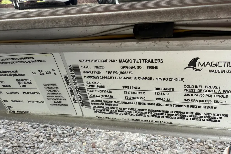 Slide: The Image of Label on Magic Tilt trailer, detailing specifications and capacities, manufactured in 09/2020. - 32