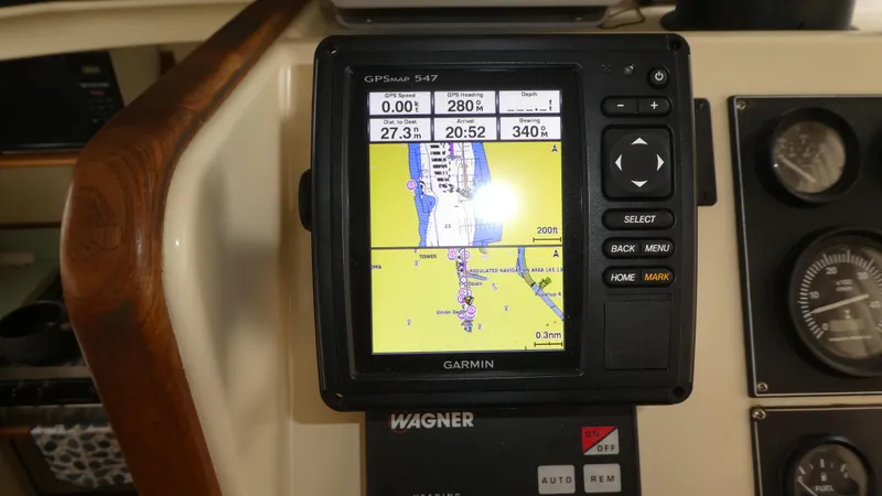 Slide: The Image of Garmin GPS navigation system on 1992 Camano 31 boat dashboard. - 10
