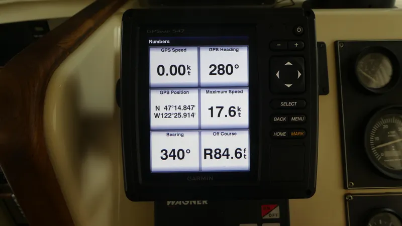Slide: The Image of GPS display on 1992 Camano 31 boat showing speed, heading, and position data. - 13