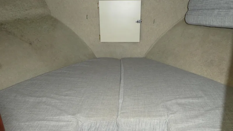 Slide: The Image of Interior cabin of a 1992 Camano 31 boat with a cozy sleeping area. - 20