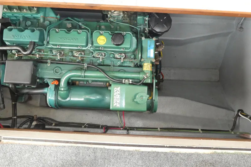 Slide: The Image of Engine compartment of a 1992 Camano 31 boat featuring a Volvo engine. - 24