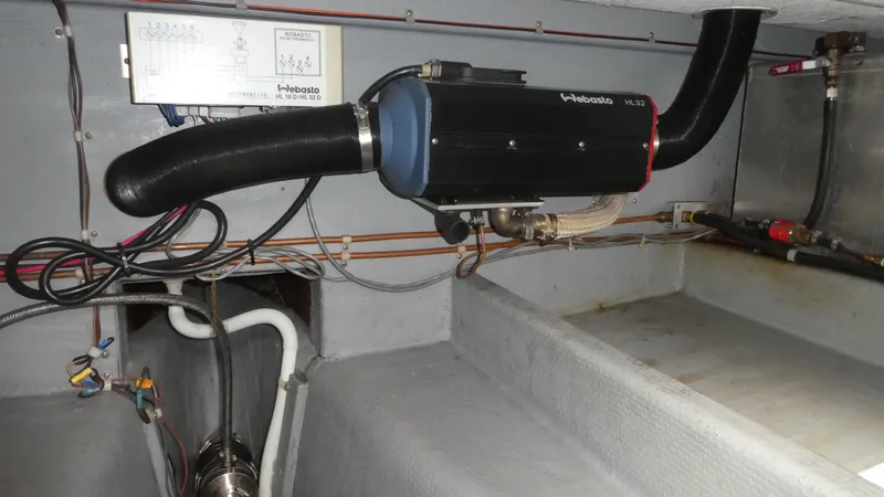 Slide: The Image of Engine room of a 1992 Camano 31 boat featuring a Webasto heater system. - 28
