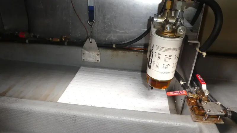 Slide: The Image of Fuel filter system in a 1992 Camano 31 boat engine compartment. - 29