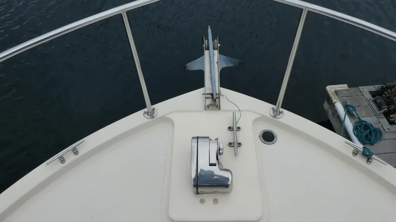 Slide: The Image of Bow of a 1992 Camano 31 boat with anchor and railing. - 35