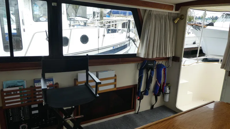 Slide: The Image of Interior of a 1992 Camano 31 boat with seating and nautical equipment. - 7