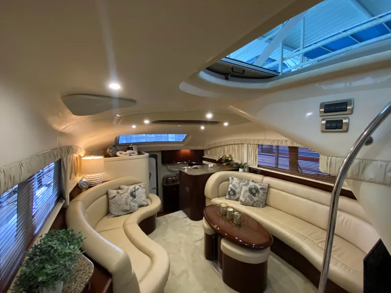 Slide: The Image of Luxurious interior of 2006 Sea Ray 40MY yacht with elegant seating and decor. - 12