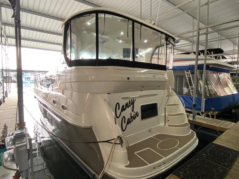 Slide: The Image of 2006 Sea Ray 40MY yacht docked in a covered marina. - 2