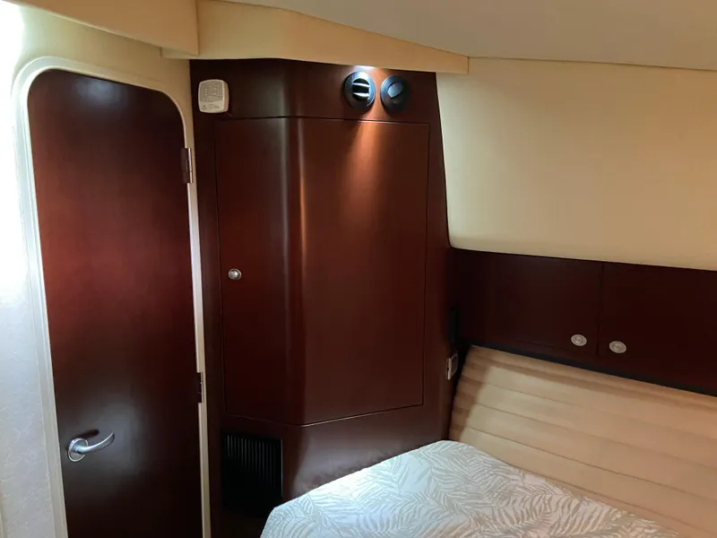 Slide: The Image of Interior cabin of 2006 Sea Ray 40MY yacht with wood paneling and bed. - 21