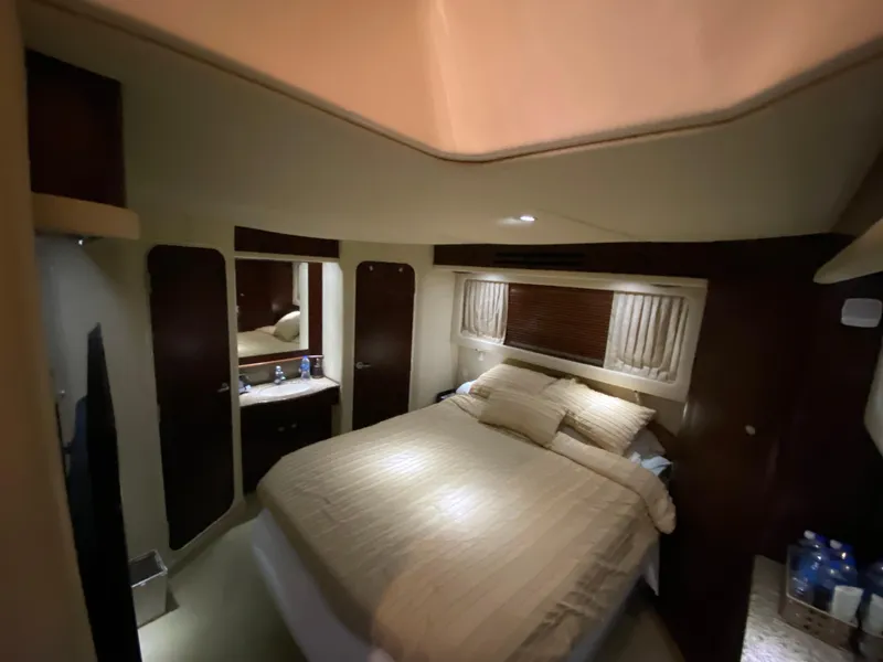 Slide: The Image of Luxurious cabin interior of 2006 Sea Ray 40MY yacht with cozy bed and elegant decor. - 25
