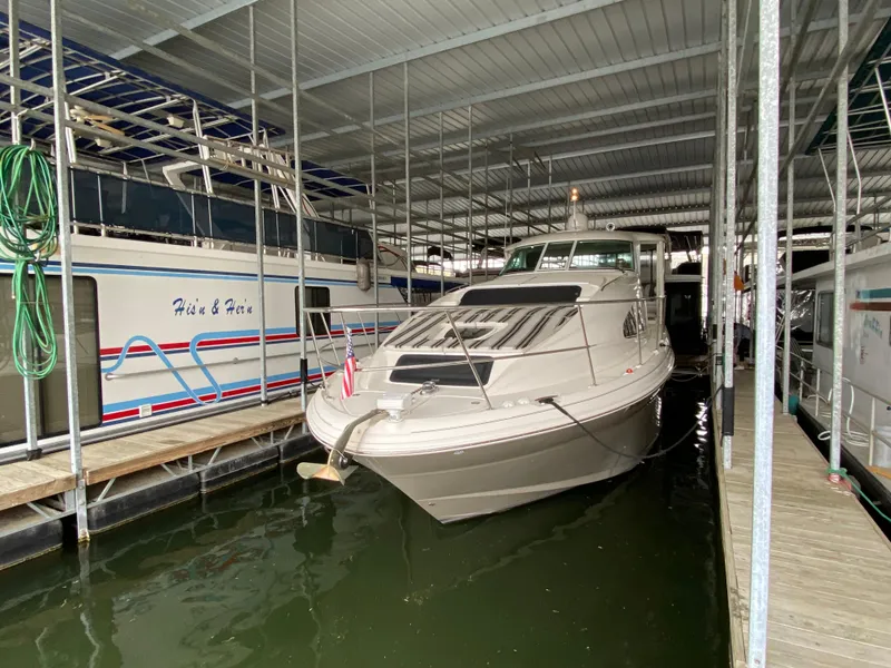 Slide: The Image of 2006 Sea Ray 40MY yacht docked in a covered marina. - 30