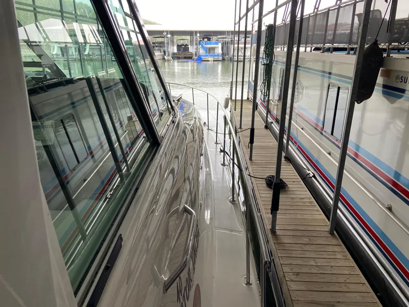 Slide: The Image of Side view of a 2006 Sea Ray 40MY yacht docked at a marina. - 33