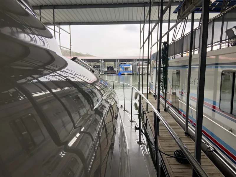 Slide: The Image of 2006 Sea Ray 40MY yacht docked in a covered marina. - 34