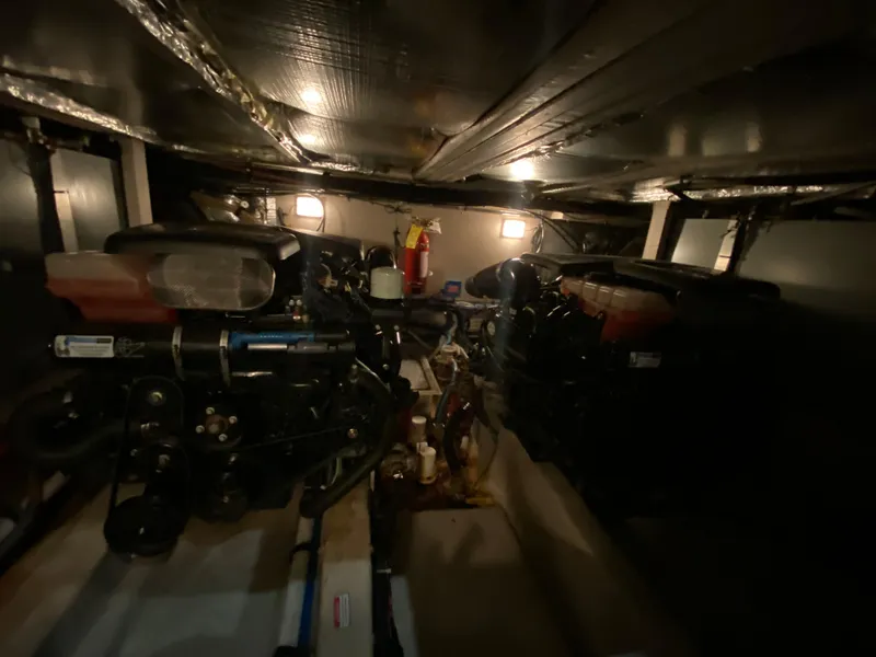 Slide: The Image of Engine room of 2006 Sea Ray 40MY yacht, featuring dual engines and fire extinguisher. - 37