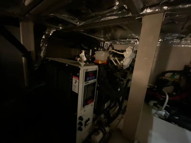 Slide: The Image of Engine room of a 2006 Sea Ray 40MY yacht, featuring mechanical components. - 42