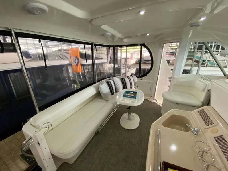 Slide: The Image of Interior of 2006 Sea Ray 40MY yacht with seating, table, and kitchenette. - 5