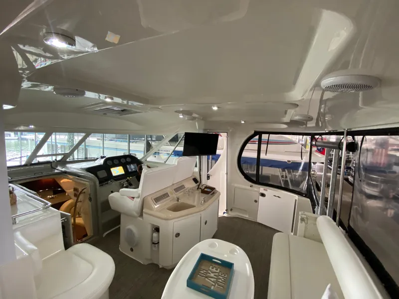 Slide: The Image of Interior of 2006 Sea Ray 40MY yacht with helm, seating, and navigation equipment. - 6