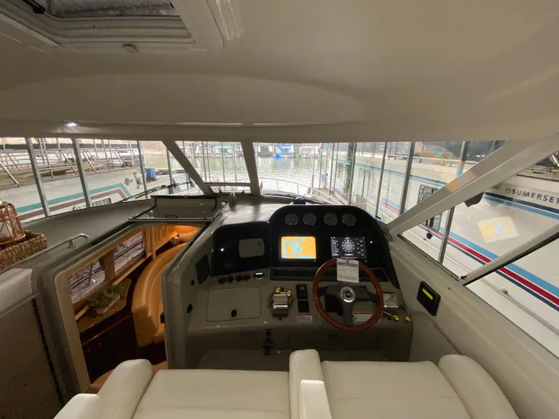 Slide: The Image of Interior view of 2006 Sea Ray 40MY yacht cockpit with navigation controls. - 9