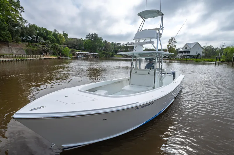 Slide: The Image of 2018 Albury Brothers 33 boat on a calm river with scenic background. - 10