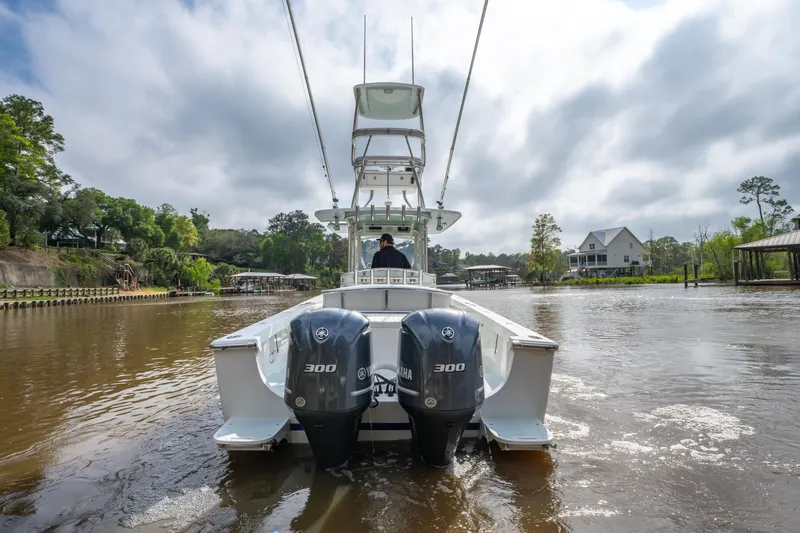 Slide: The Image of 2018 Albury Brothers 33 boat with dual 300 engines on a calm river. - 13