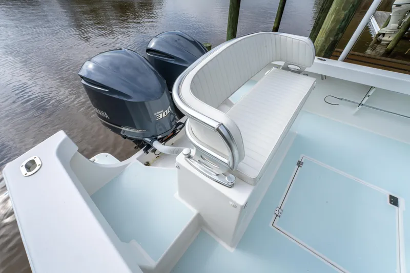 Slide: The Image of 2018 Albury Brothers 33 boat with twin engines and white seating. - 17