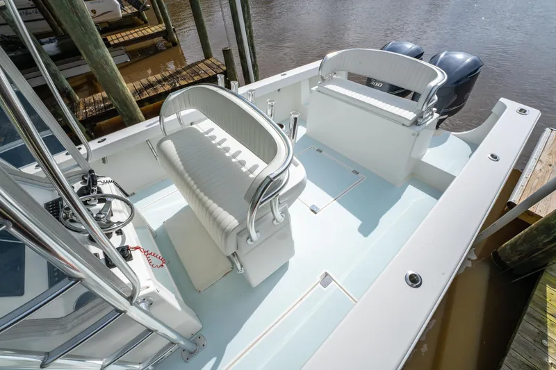 Slide: The Image of 2018 Albury Brothers 33 boat interior with seating and dual outboard engines. - 19
