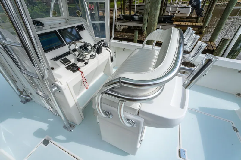 Slide: The Image of 2018 Albury Brothers 33 boat cockpit with steering wheel and seating. - 21