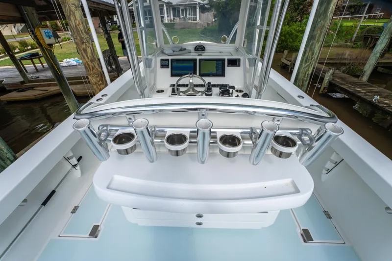Slide: The Image of 2018 Albury Brothers 33 boat cockpit with rod holders and navigation equipment. - 22