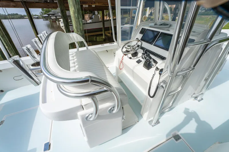 Slide: The Image of 2018 Albury Brothers 33 boat cockpit with helm, dual screens, and seating. - 23