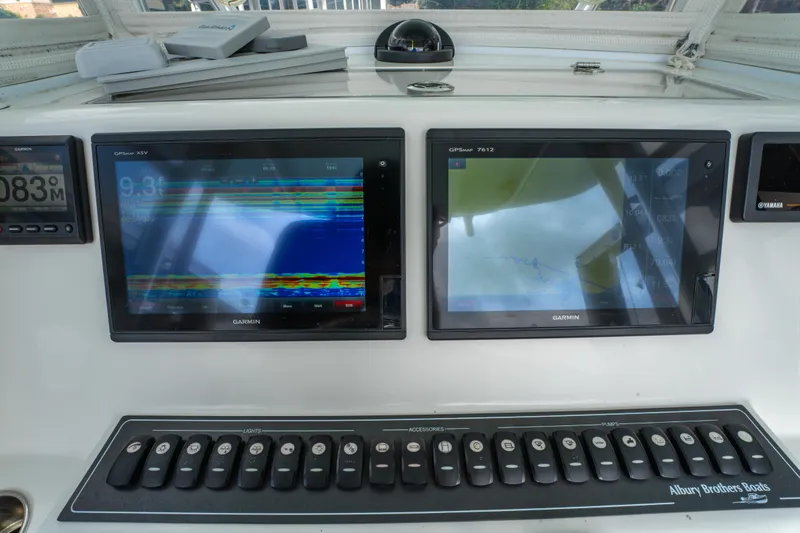 Slide: The Image of Control panel of a 2018 Albury Brothers 33 boat with dual Garmin displays. - 26