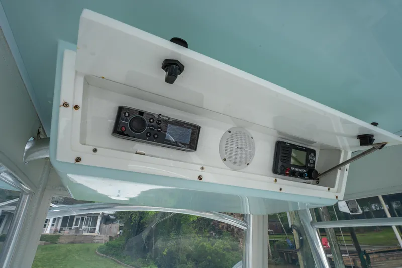 Slide: The Image of 2018 Albury Brothers 33 boat electronics panel with radio and speaker. - 28