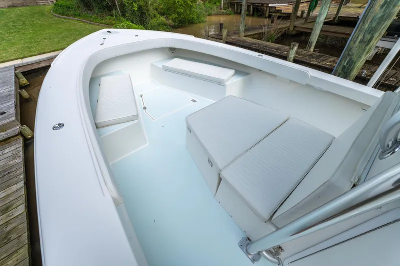 Slide: The Image of 2018 Albury Brothers 33 boat interior with cushioned seating and spacious deck. - 31