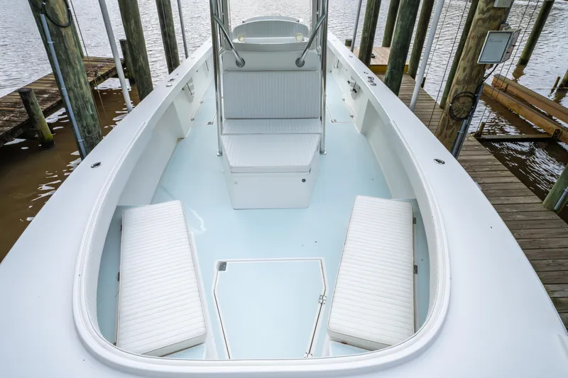 Slide: The Image of 2018 Albury Brothers 33 boat interior with white seating and clean deck. - 32