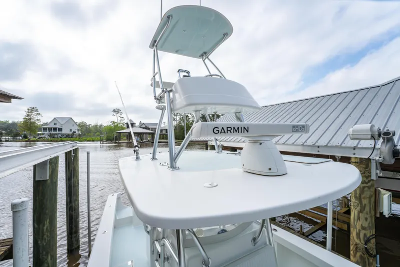 Slide: The Image of 2018 Albury Brothers 33 boat with Garmin radar, docked by waterfront homes. - 34