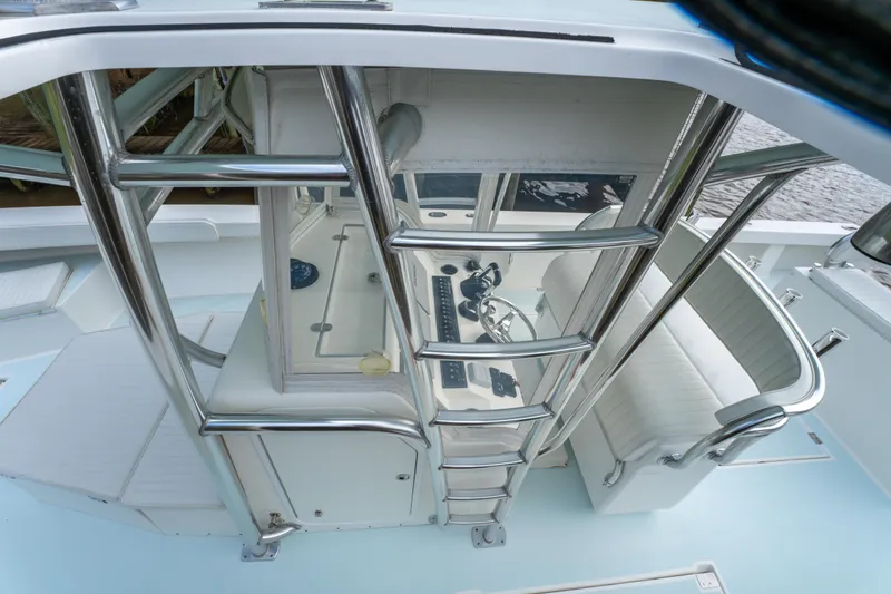 Slide: The Image of 2018 Albury Brothers 33 boat interior with helm station and seating. - 35