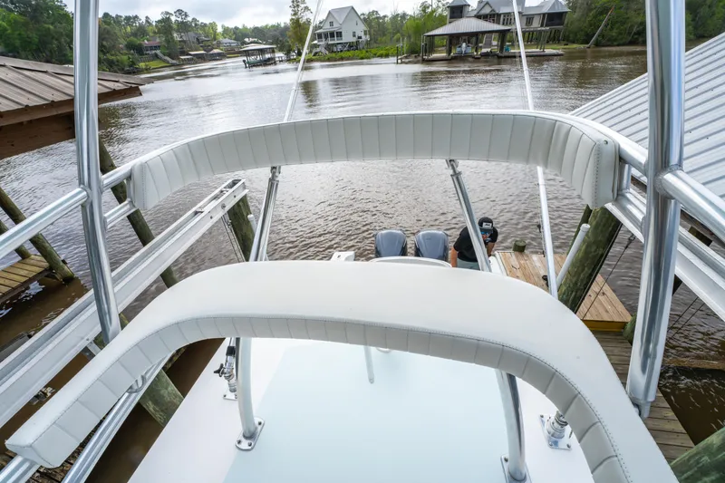 Slide: The Image of 2018 Albury Brothers 33 boat docked by a scenic waterfront with houses. - 37