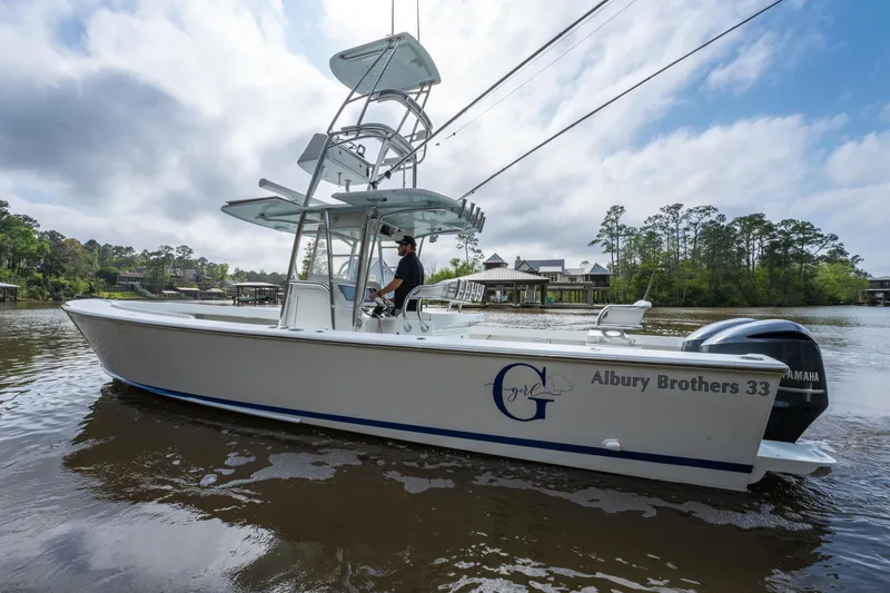Slide: The Image of 2018 Albury Brothers 33 boat on water, featuring sleek design and Yamaha engine. - 8