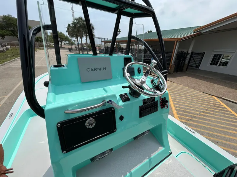 Slide: The Image of 2022 Shallow Sport 25 X3 boat dashboard with Garmin navigation system. - 16