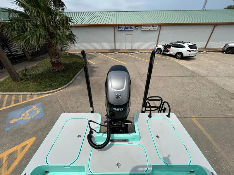 Slide: The Image of 2022 Shallow Sport 25 X3 boat with 350 HP engine in parking lot. - 7