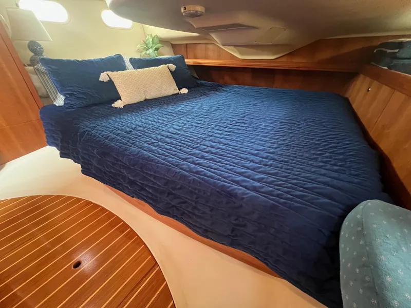 Slide: The Image of Luxurious cabin interior of 2002 Hunter 386 yacht with blue bedding. - 24