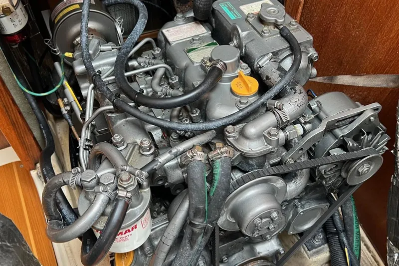 Slide: The Image of 2002 Hunter 386 engine with visible components and wiring in a compact space. - 38