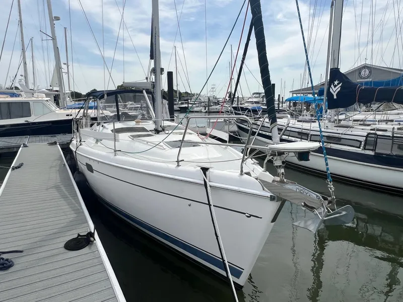 Slide: The Image of Sailboat docked at marina, 2002 Hunter 386 model, white hull, clear sky. - 4