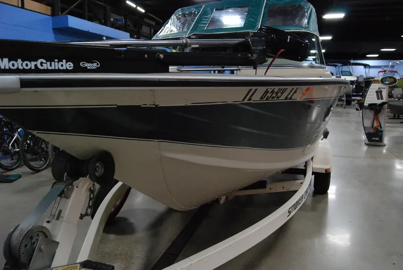 Slide: The Image of 1998 Smoker Craft 178 Fazer boat on trailer in indoor storage. - 12
