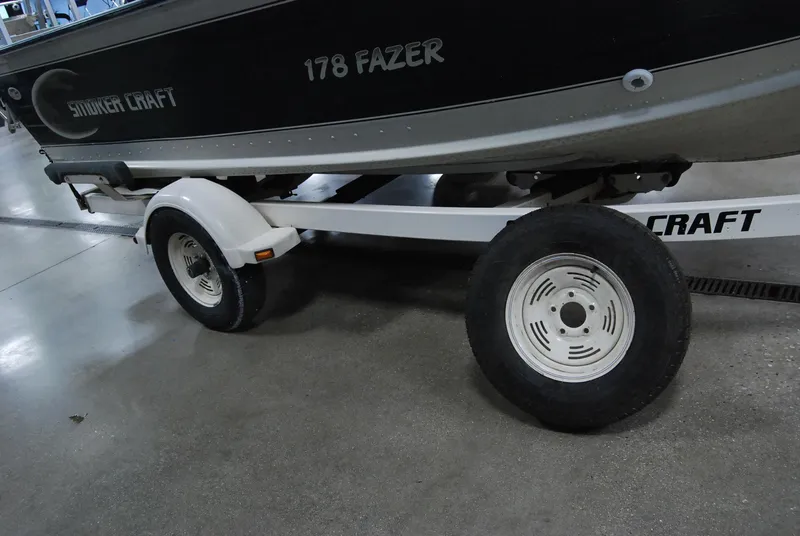 Slide: The Image of 1998 Smoker Craft 178 Fazer boat on trailer, side view. - 14